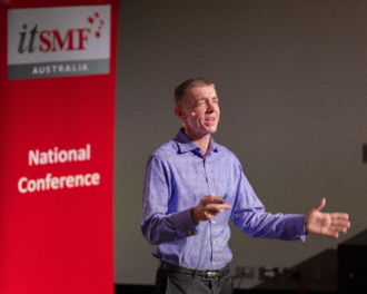 Daryl With His Hands Out Delivering A Highly Impactful Moment Of His Keynote At The Itsmf Australia Annual National Conference 2023.
